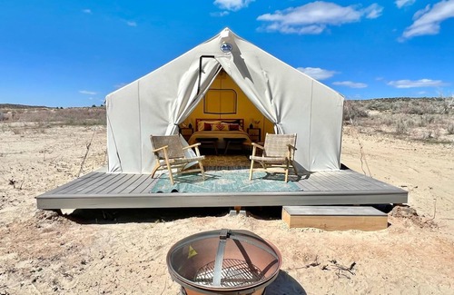 Levan House | Beautiful wall tent on sandy beach at waters edge