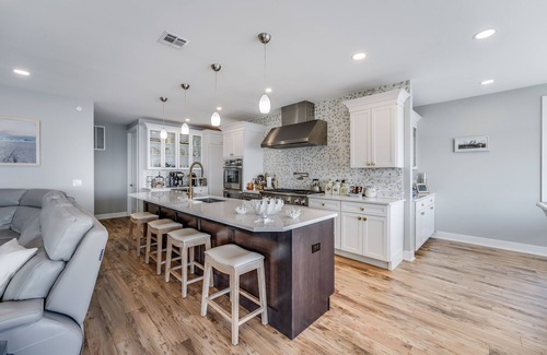 Osbornsville House | Beautiful waterfront 8-BR house w pool patio, outdoor bar, dock, putting green!