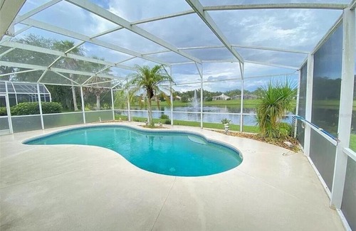 Sunridge Woods House | Beautiful Waterfront Home with Heated Pool and Game Room