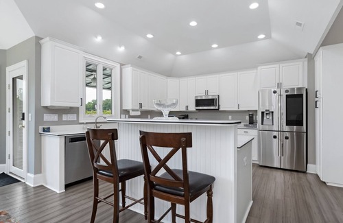 Rock Hill House | Beautiful Waterfront Home with abundant outdoor seating, pool, hot tub, grill