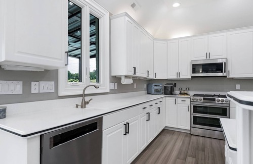 Rock Hill House | Beautiful Waterfront Home with abundant outdoor seating, pool, hot tub, grill