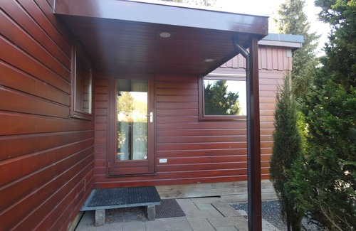 Marum Ski Chalet | Beautiful wooden chalet for rent against forest