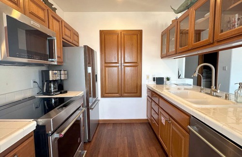 Avalon Condo | Beautifully Remodeled Premium Ocean View Condo with Fireplace and Golf Cart!