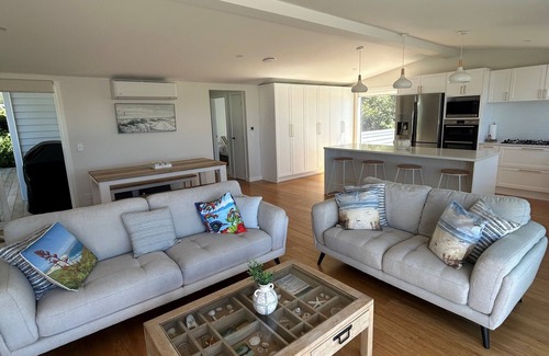 Oakura House | Beautifully renovated 5-bedroom bach just steps from the sand.