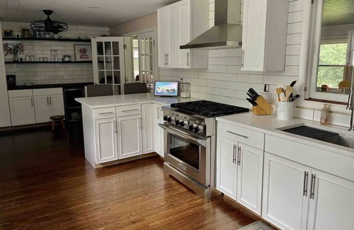 Rochester House | Beautifully renovated Brighton home on private inside corner lot.