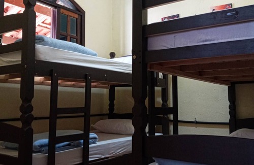 Itamambuca Cabin | Bed in shared room
