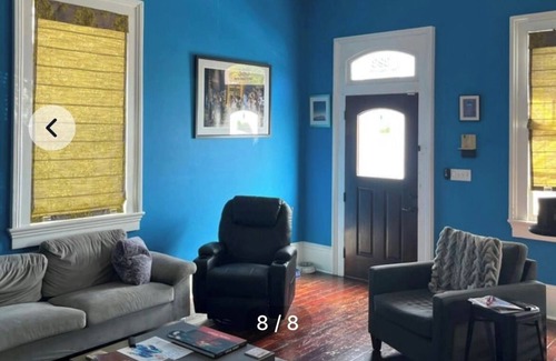 Treme House | bedroom and en suite bath in historic New Orleans home with pool & WiFi