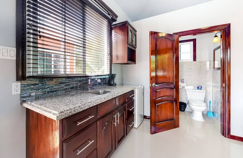 Dangriga House | Belizean estate rental, group-friendly lodging, W/Shared Pool & Tennis