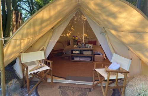 Washford Cabin | Bell tent in ultimate luxury with a wood fired hot tub, super king size bed