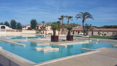 Portiragnes-Plage Villa | Belle villa d'angle spacieuse climatisée, de tout confort dans domaine PORTES DU SOLEIL, ACCES PISCINES PAYANT EN SUPPL - 3 chambres, 6 couchages, wifi, 400m de la mer LRPDSJ7