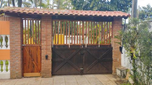 Jardim Neptunia House | Bertioga pé na areia com piscina no Cantão do Indaiá