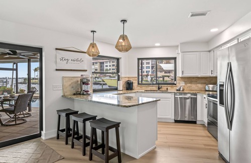 Caloosahatchee House | Best Home in the Cape! Brand New Remodel! - River View! - Tiki Hut on the Water!
