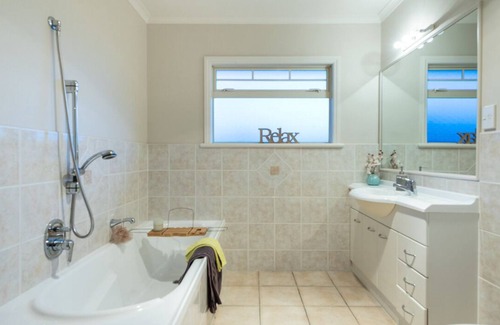 Papamoa Beach House | Better than a resort! Swimming pool, spa, pool-table. Walk to beach,shops,cafes.