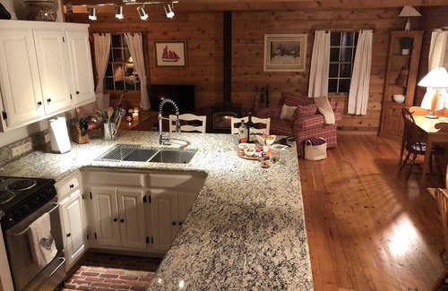 Suttons Bay House | Big Sandy Beach !Walk to Village! Suttons Bay Waterfront Cottage.