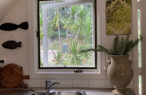 Pretty Beach Apartment | BIRDSONG Stylish private couples loft with water glimpses through the treetops.