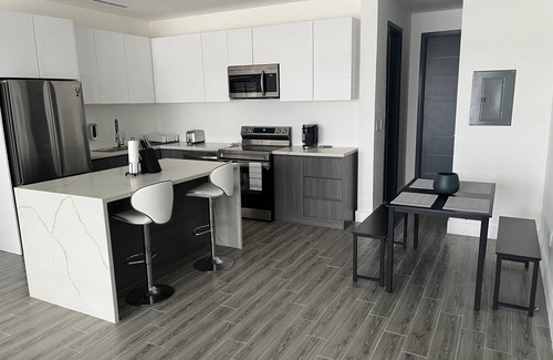 Nassau Condo | Blu at Villa Nova. Stylish Modern Condo, Minutes away from the Beach.