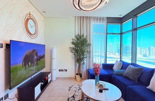Al Hoora Apartment | Blue Seaview 75 inch Smart TV 1Br