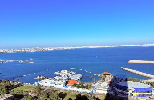 Al Hoora Apartment | Blue Seaview 75 inch Smart TV 1Br