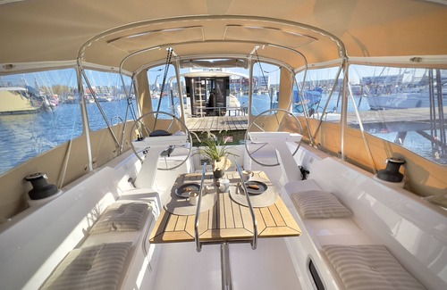 Ostholstein Boat Rental | Boat 'Hausboot Segelyacht Nui' on the sea and Private Terrace