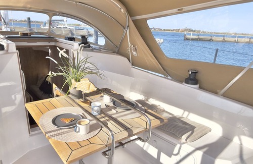 Ostholstein Boat Rental | Boat 'Hausboot Segelyacht Nui' on the sea and Private Terrace