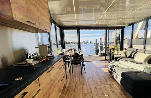 Heiligenhafen Boat Rental | Boat 'Hausboot Mit Motorboot' with Sea View, Terrace & Wi-Fi