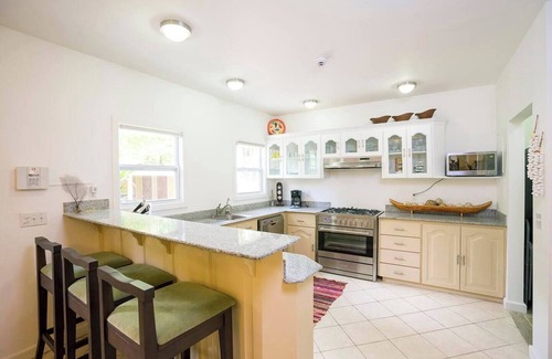 Antoneys Cay House | Boat House Beach Suite by Island House Vacation Rentals