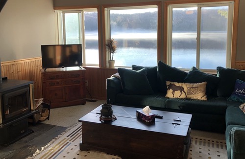 Novar Cottage | Boathouse Cottage on the water, access to snowmobile trails and ice fishing.