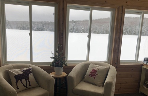 Novar Cottage | Boathouse Cottage on the water, access to snowmobile trails and ice fishing.