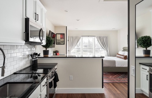 Bellaire Apartment | Boutique Resort Studio with Hot Tubs, Sauna, & More. Walk to Downtown Bellaire!