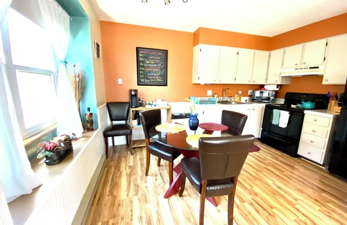 University Park Apartment | Boutique Studio Apartment Hotel across from CSU in Old Town Fort Collins! Light filled space that will transport and capture your heart. Curl up and read a book, let your mind wander from your private balcony as the giant oak tree blows in the breeze