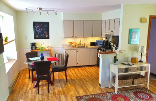 University Park Apartment | Boutique Studio Apartment Hotel across from CSU in Old Town Fort Collins! Light filled space that will transport and capture your heart. Curl up and read a book, let your mind wander from your private balcony as the giant oak tree blows in the breeze