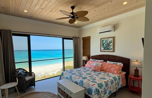 Farmer's Hill Villa | BRAND NEW! Breathtaking Beachfront Palm Grove Villa: Beach, Pool, Spa, Palms!