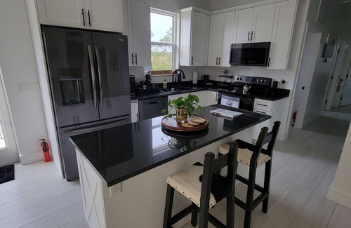 Sebring House | Brand-new, quiet, cozy home with a modern country design and peaceful charm.