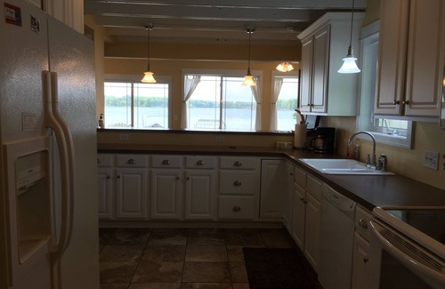Delton Cottage | Brenda's Beach House - Sandy beach, gentle sloping lake bottom.