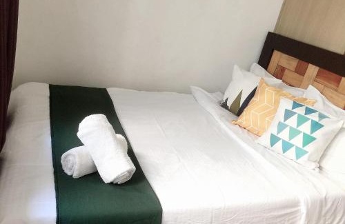 Ususan Apartment | Bright and Cozy 1 Bedroom with Balcony Pool View and WiFi in Grace Residences
