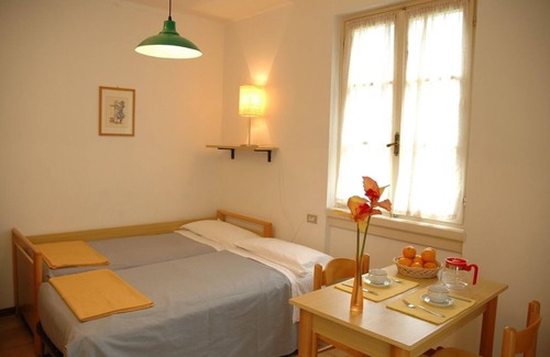Domaso Resort | Bright and modern apartments with pool and beach and luxurious villas on the S