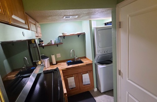 Walnut Grove Apartment | Bright and private basement studio with full laundry in rental.