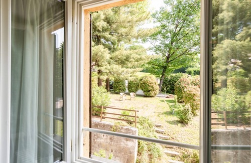 Villa Guardia Apartment | Bright APT surrounded by greenery with parking!