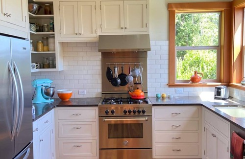 Lopez Island House | Bright art-filled home, fruit trees, valley view