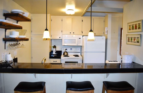 Mammoth Lakes Condo | Bright corner condo overlooking the pool, #154 is steps from the shuttle