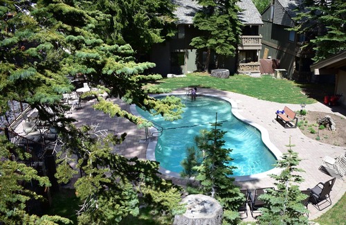 Mammoth Lakes Condo | Bright corner condo overlooking the pool, #154 is steps from the shuttle