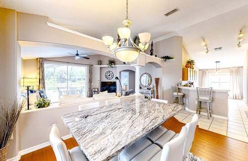 Eagle Pointe South House | Bright home with an enclosed pool, patio, Ping-Pong table, foosball, and AC