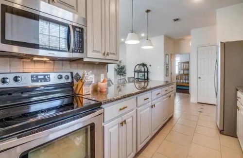 Enchanted Oaks House | Bright lakeside bliss. Your vibrant retreat awaits!