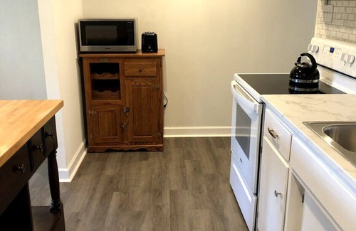Hickory Apartment | Bright open studio apartment with king bed and queen sofabed. Walk to local shops and restaurants.