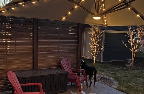 Okotoks House | Bright, spacious family home with great a outdoor space overlooking green space.