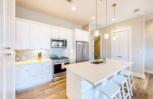 Rockport Villa | Bright waterfront villa with pool, boat slip, patio & balcony in gated community
