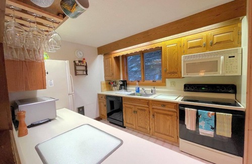 Bromley Mountain House | Bromley's Ridges 3-Level Townhouse just a short walk to the ski trailswith