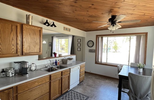 Newaygo House | Brookside Retreat- Charming home with lakes and rivers nearby