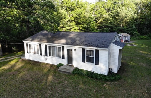 Newaygo House | Brookside Retreat- Charming home with lakes and rivers nearby