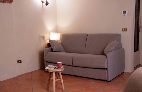 Lessona Bed & Breakfast | Bruno Selvago's Casba. Rustic house with exposed brick surrounded by vineyards.